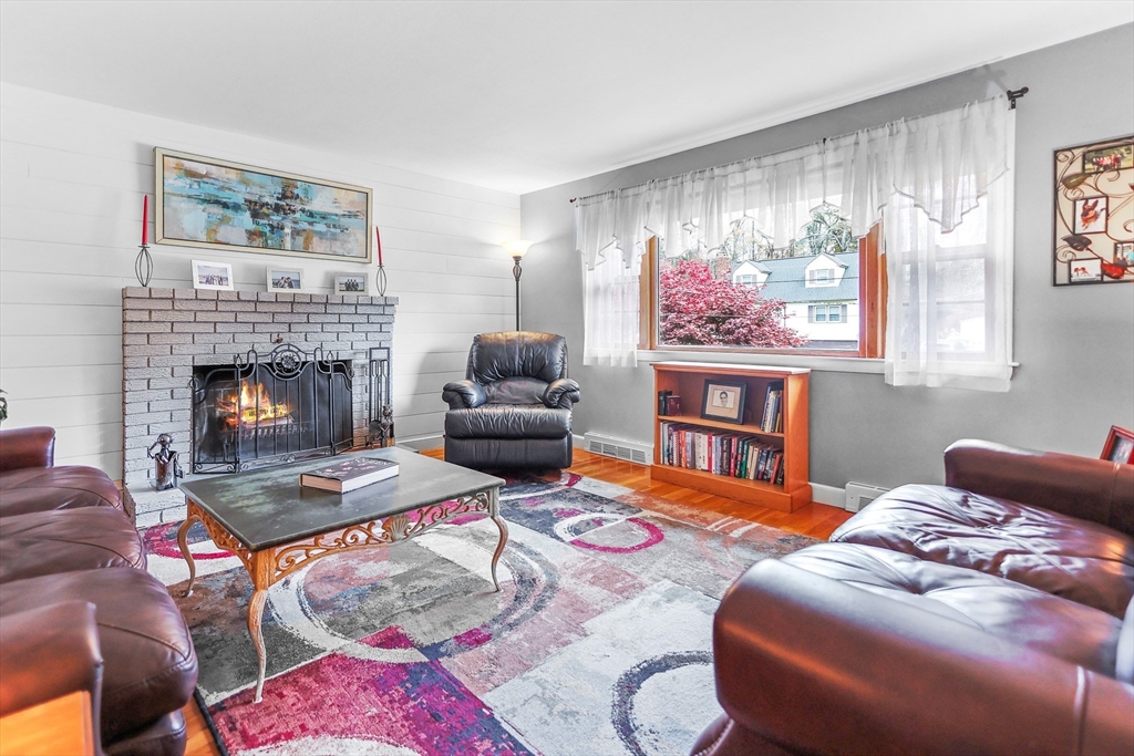 86 Butternut Lane Methuen, MA 01844 - Photo 16 of 32 a living room with furniture fireplace and window