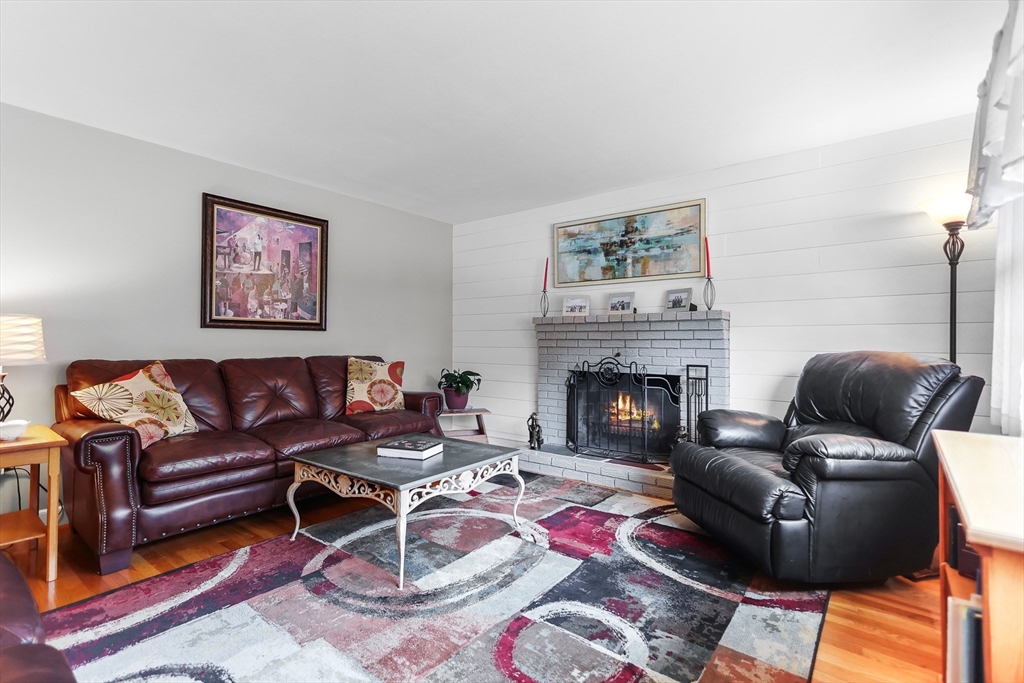 86 Butternut Lane Methuen, MA 01844 - Photo 17 of 32 a living room with furniture and a fireplace