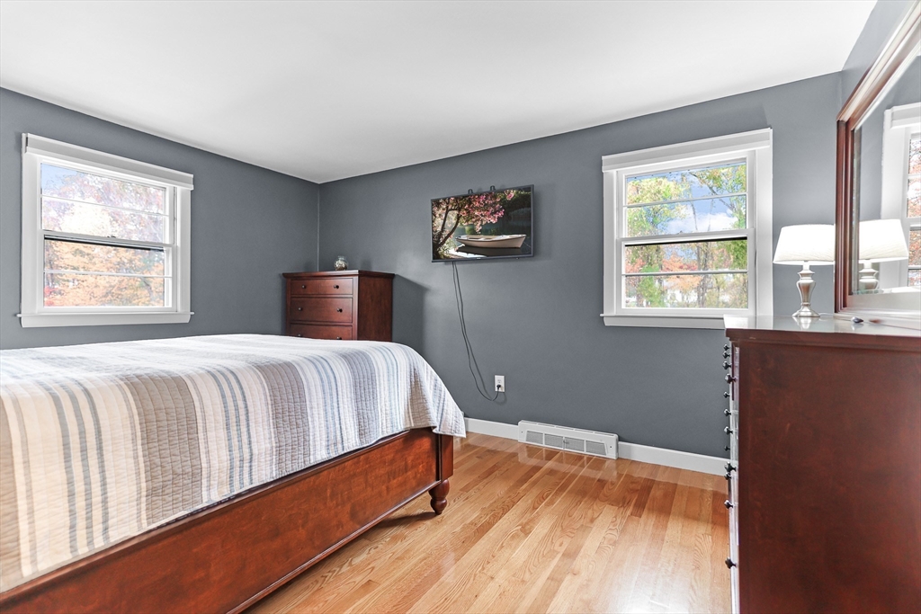 86 Butternut Lane Methuen, MA 01844 - Photo 19 of 32 a bedroom with a bed and wooden floor