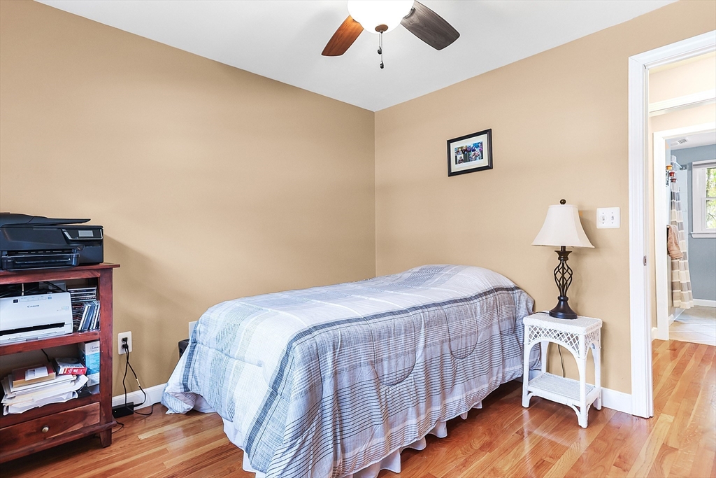 86 Butternut Lane Methuen, MA 01844 - Photo 22 of 32 a bedroom with a bed and wooden floor