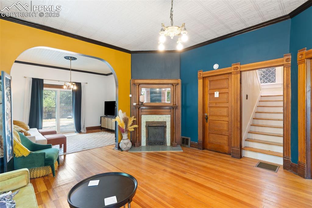 732 Rudd Avenue Canon City, CO 81212 - Photo 11 of 36 a living room with furniture a fireplace and wooden floor
