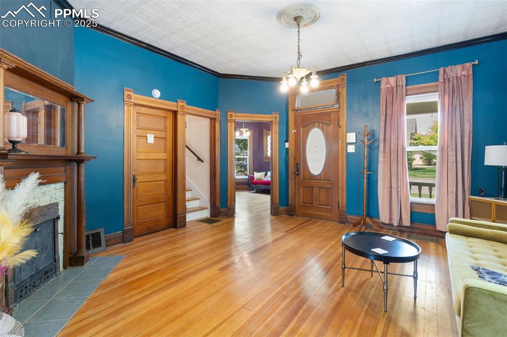 732 Rudd Avenue Canon City, CO 81212 - Photo 12 of 36 a view of a livingroom with furniture window and wooden floor