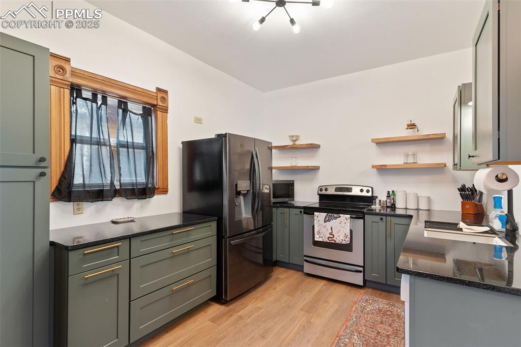 732 Rudd Avenue Canon City, CO 81212 - Photo 15 of 36 a kitchen with stainless steel appliances a refrigerator stove and sink