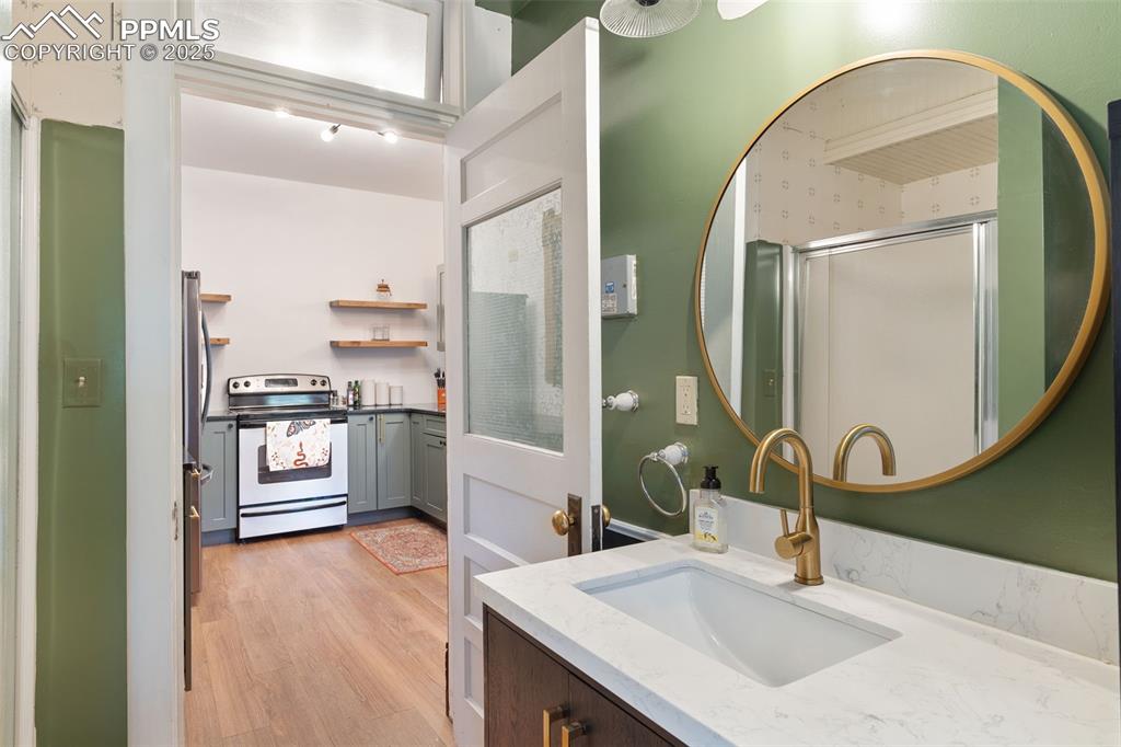732 Rudd Avenue Canon City, CO 81212 - Photo 19 of 36 a bathroom with a sink and a mirror