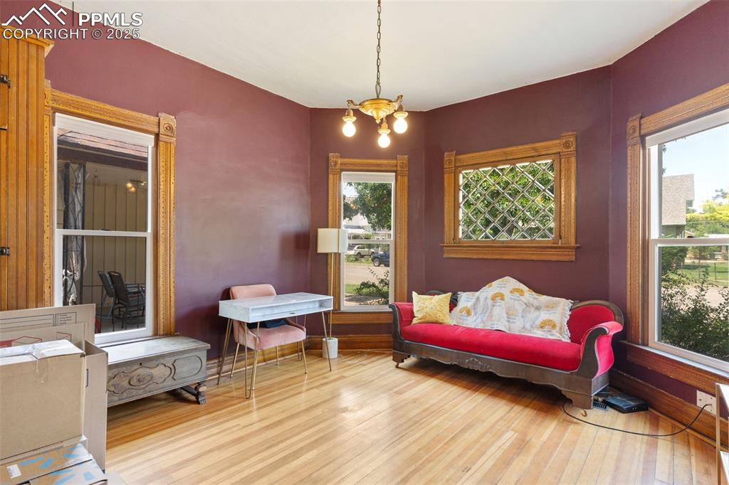 732 Rudd Avenue Canon City, CO 81212 - Photo 22 of 36 a bedroom with a bed and wooden floor