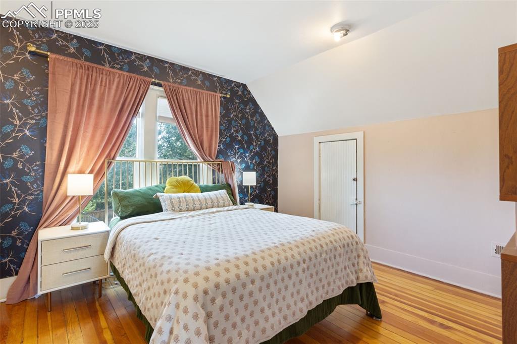 732 Rudd Avenue Canon City, CO 81212 - Photo 24 of 36 a bedroom with a bed and a large window