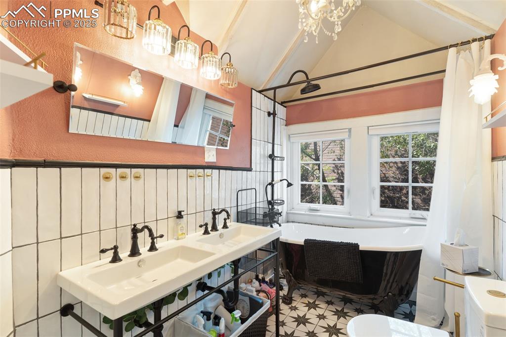 732 Rudd Avenue Canon City, CO 81212 - Photo 28 of 36 a bathroom with a sink vanity and a mirror