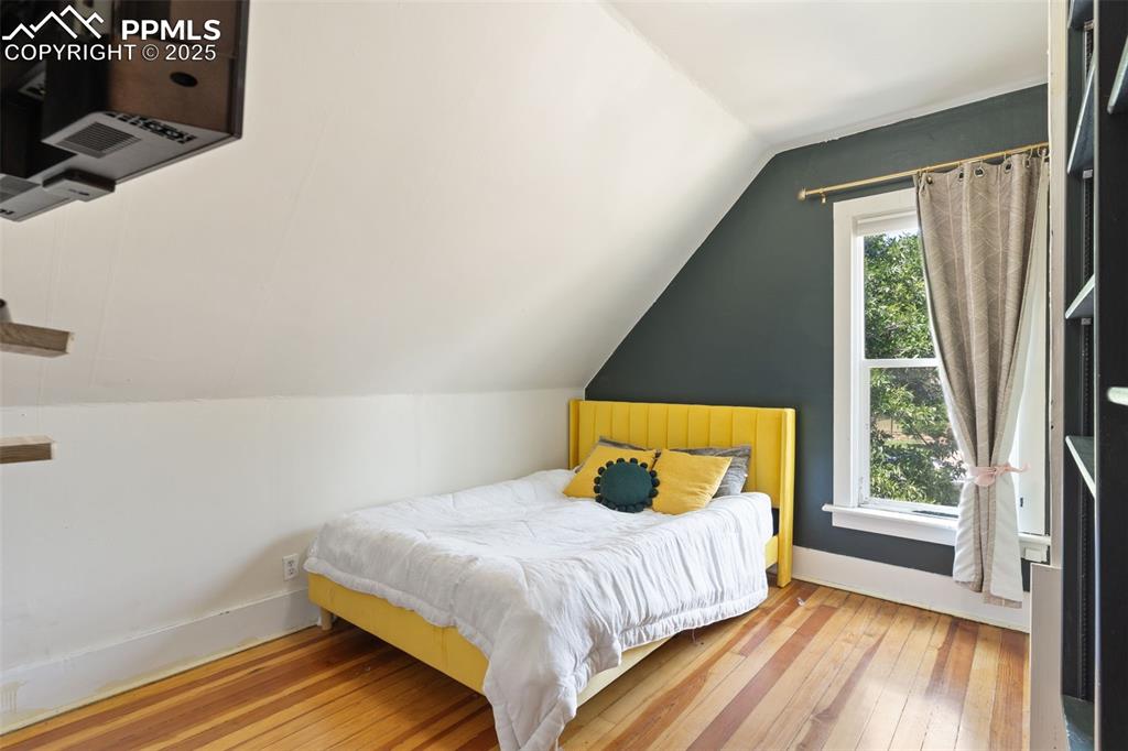 732 Rudd Avenue Canon City, CO 81212 - Photo 29 of 36 a bedroom with a bed and a window