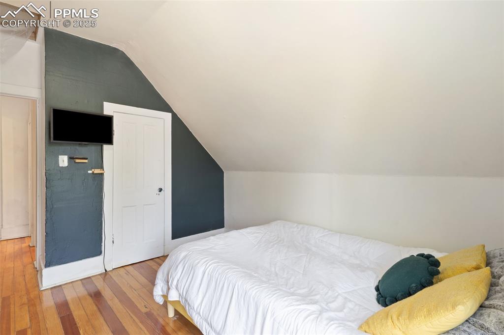 732 Rudd Avenue Canon City, CO 81212 - Photo 30 of 36 a bedroom with a bed and a flat screen tv