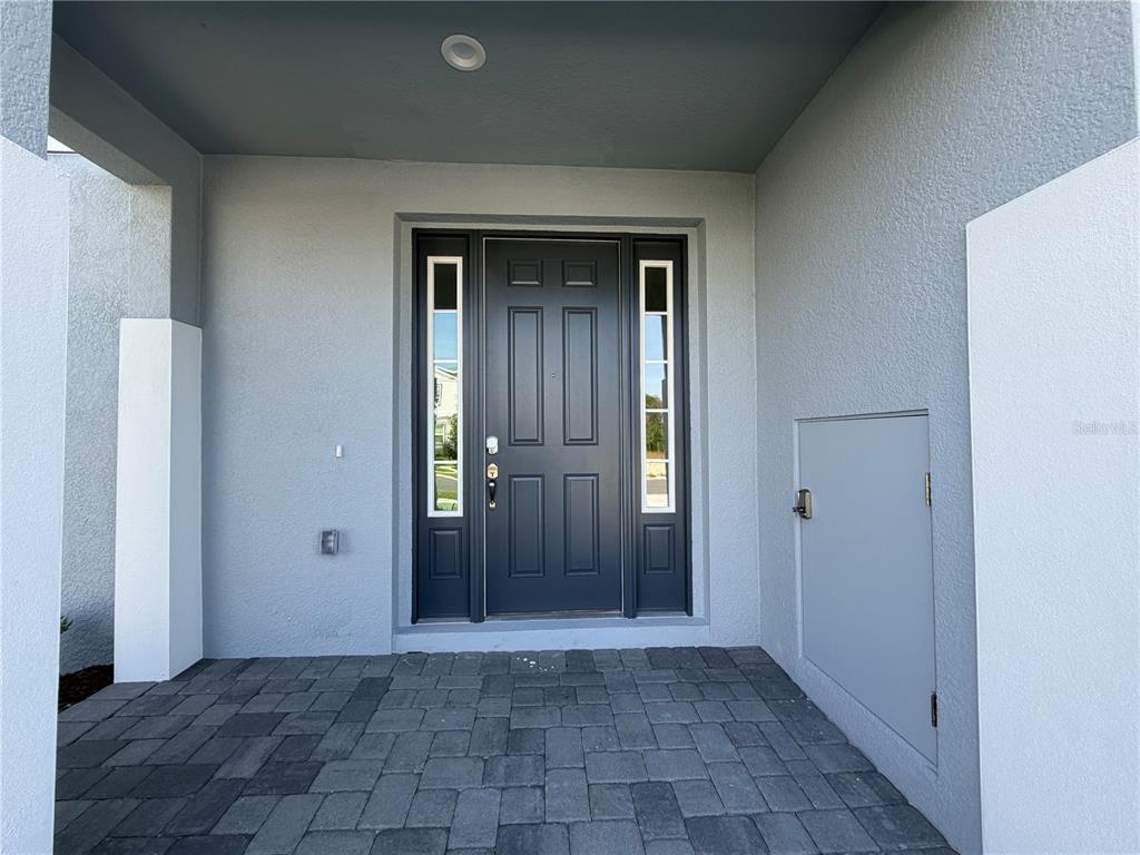 756 Farfields Street DeLand, FL 32724 - Photo 2 of 13 a view of a hallway with wooden shelves