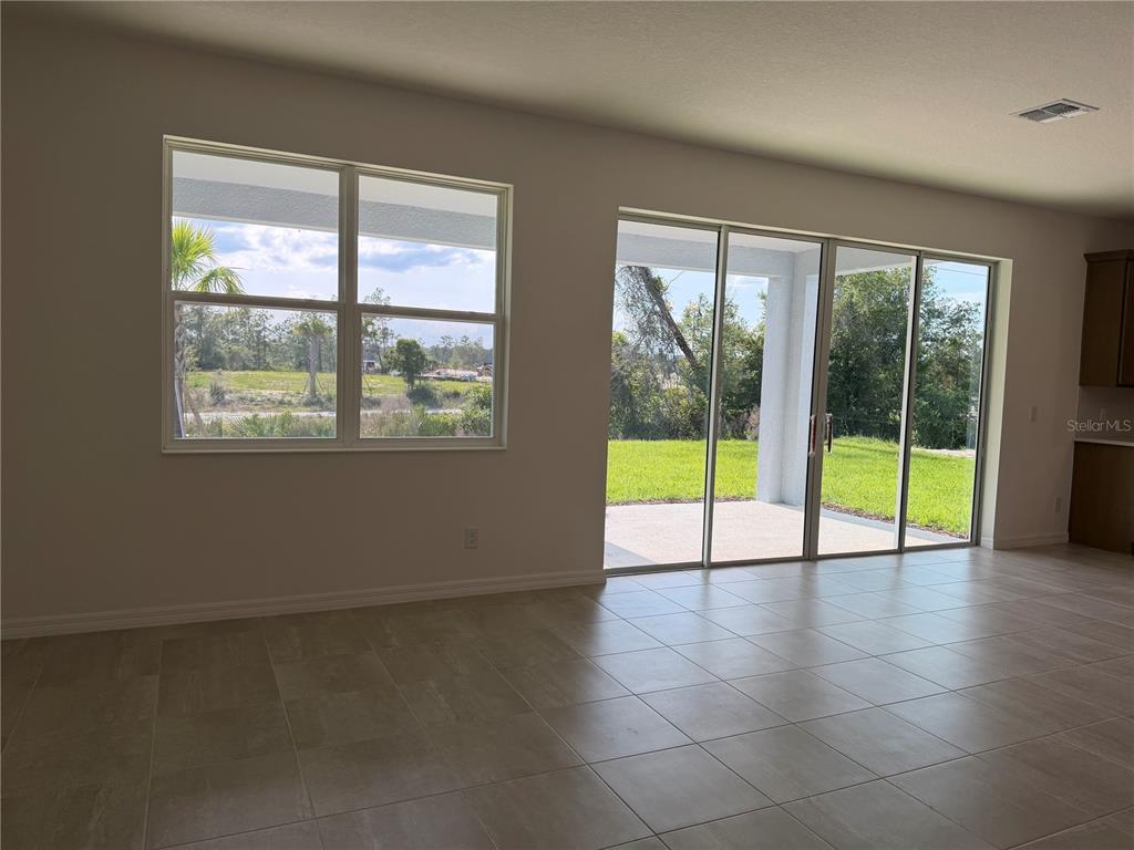 756 Farfields Street DeLand, FL 32724 - Photo 4 of 13 a view of an entryway with a garden