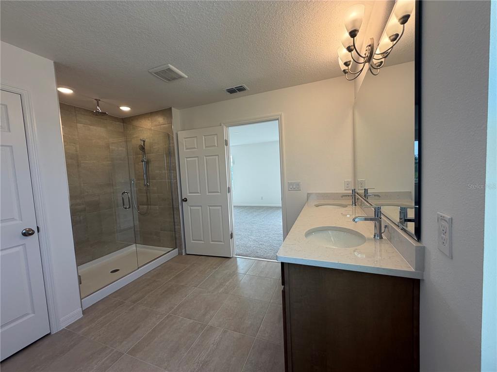756 Farfields Street DeLand, FL 32724 - Photo 10 of 13 a bathroom with a sink shower and a mirror