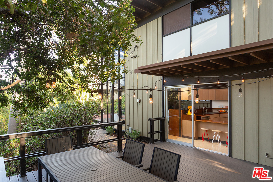 1617 Pleasant Way Pasadena, CA 91105 - Photo 15 of 19 a view of a roof deck with couches and wooden floor