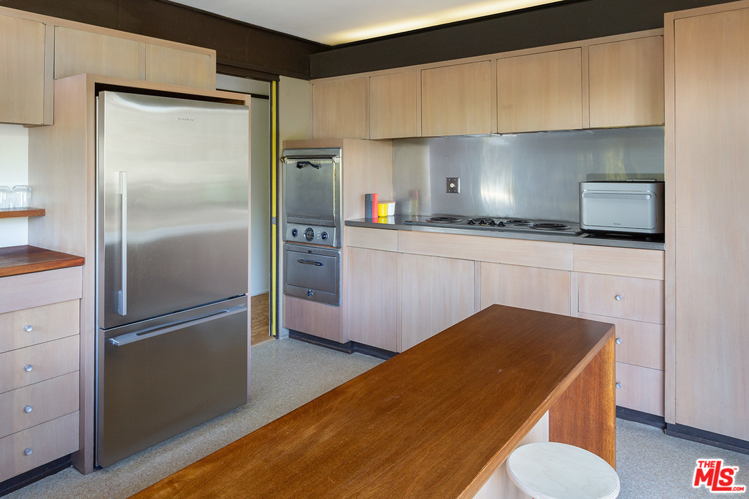 1617 Pleasant Way Pasadena, CA 91105 - Photo 7 of 19 a kitchen with stainless steel appliances granite countertop a refrigerator a stove and a sink with wooden floor