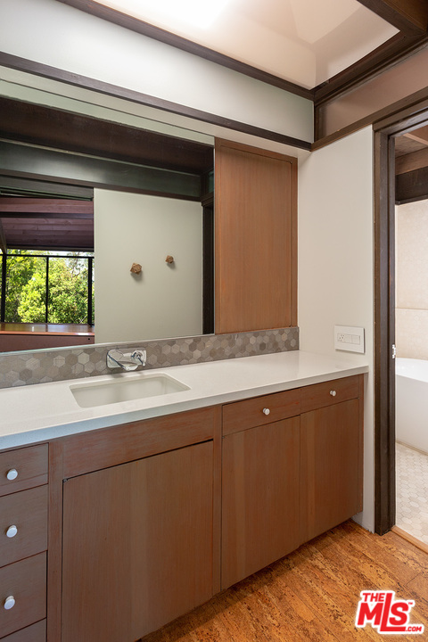 1617 Pleasant Way Pasadena, CA 91105 - Photo 10 of 19 a bathroom with a double vanity sink and mirror