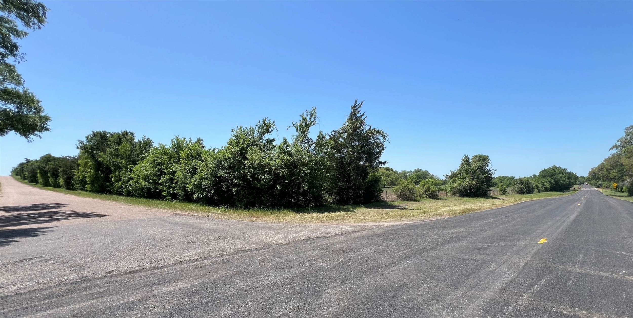 0 Fm 1579 And Langdon Road Schulenburg, TX 78956 - Photo 11 of 12 a view of a field with trees in background