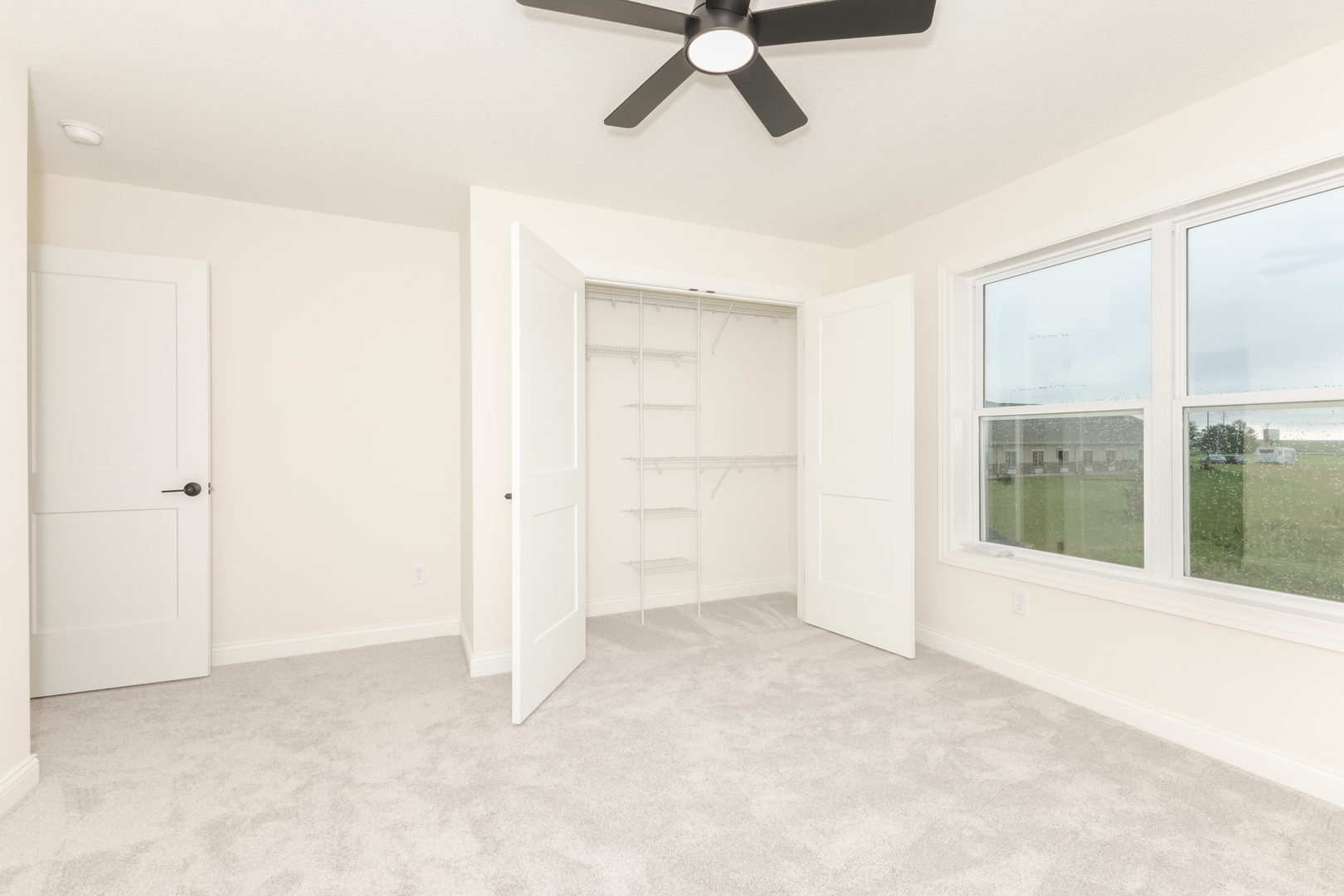 1313 Woodbine Road Bloomington, IL 61704 - Photo 11 of 67 a view of an empty room with a window