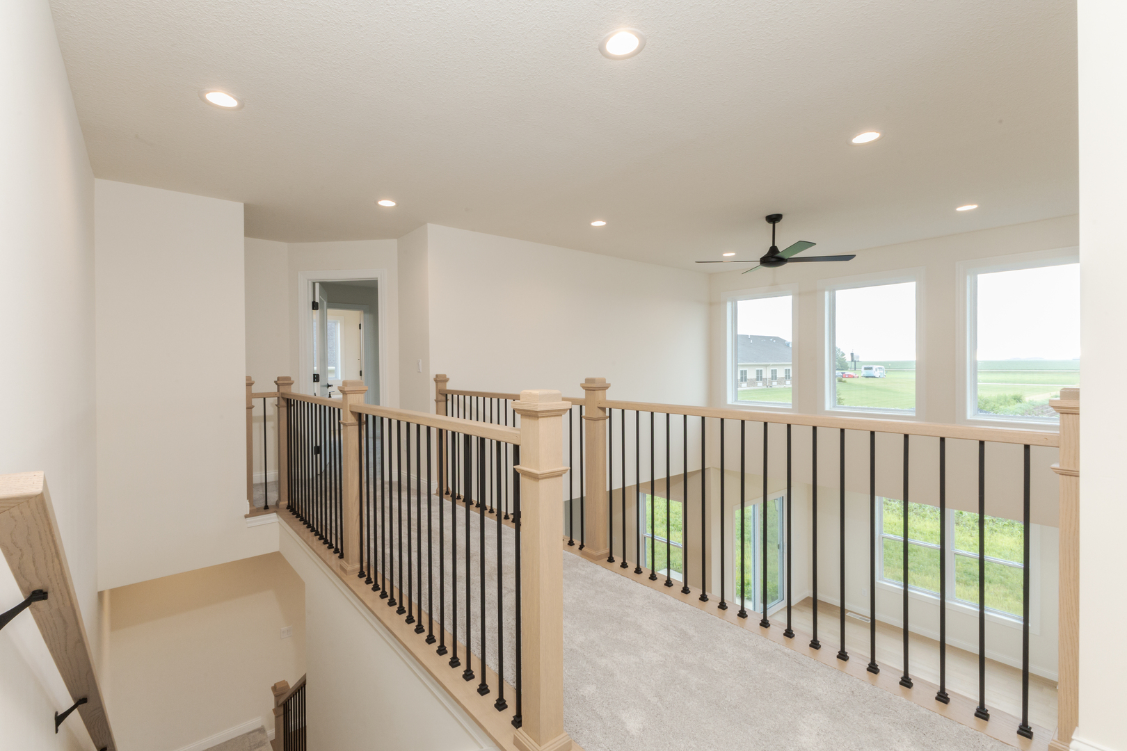 1313 Woodbine Road Bloomington, IL 61704 - Photo 14 of 67 a view of a hallway with windows