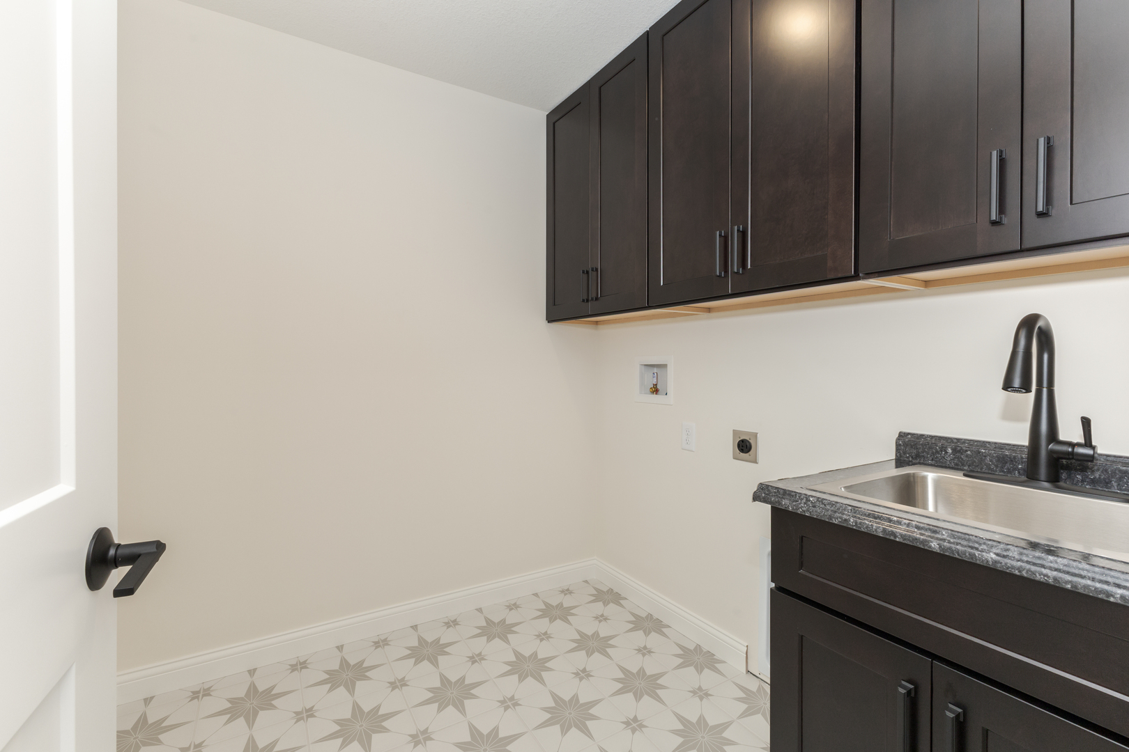 1313 Woodbine Road Bloomington, IL 61704 - Photo 16 of 67 a kitchen with a sink and cabinets