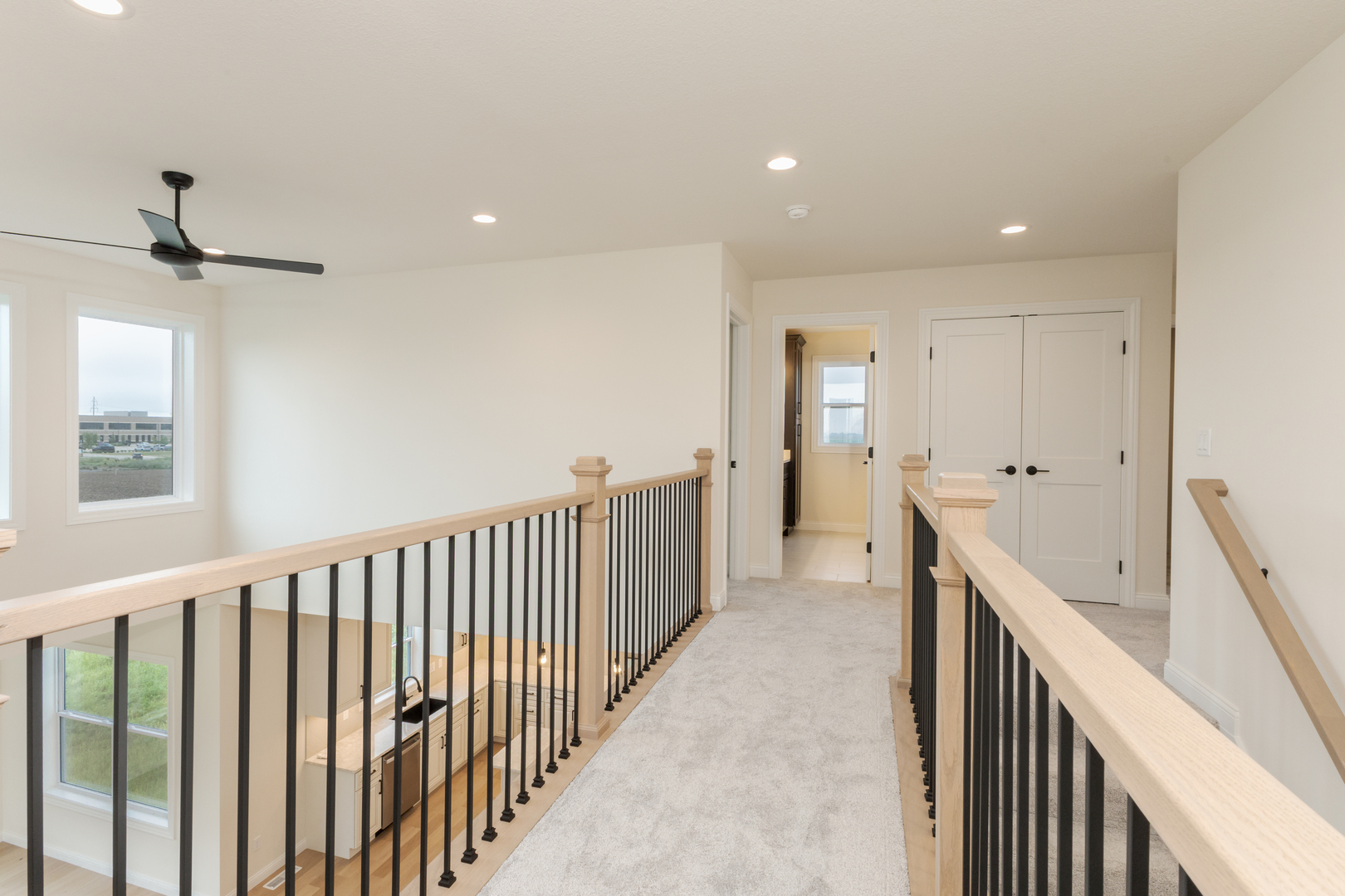 1313 Woodbine Road Bloomington, IL 61704 - Photo 19 of 67 a view of a hallway with closet and wooden floor