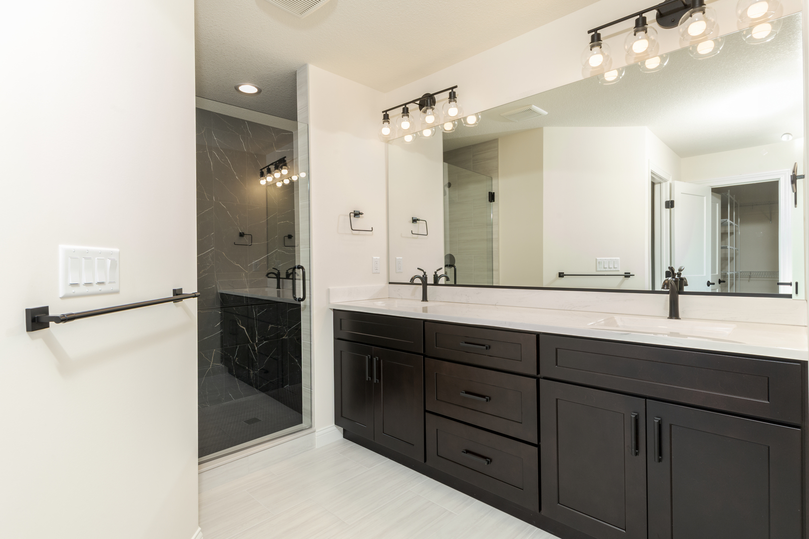 1313 Woodbine Road Bloomington, IL 61704 - Photo 23 of 67 a spacious bathroom with a double vanity sink mirror and double