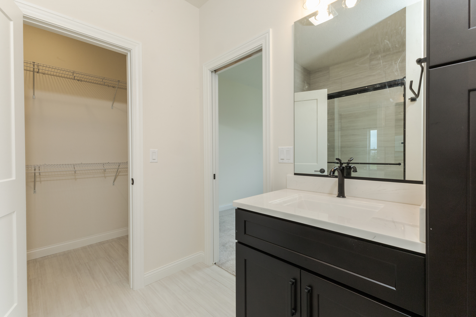 1313 Woodbine Road Bloomington, IL 61704 - Photo 33 of 67 a bathroom with a sink and a mirror