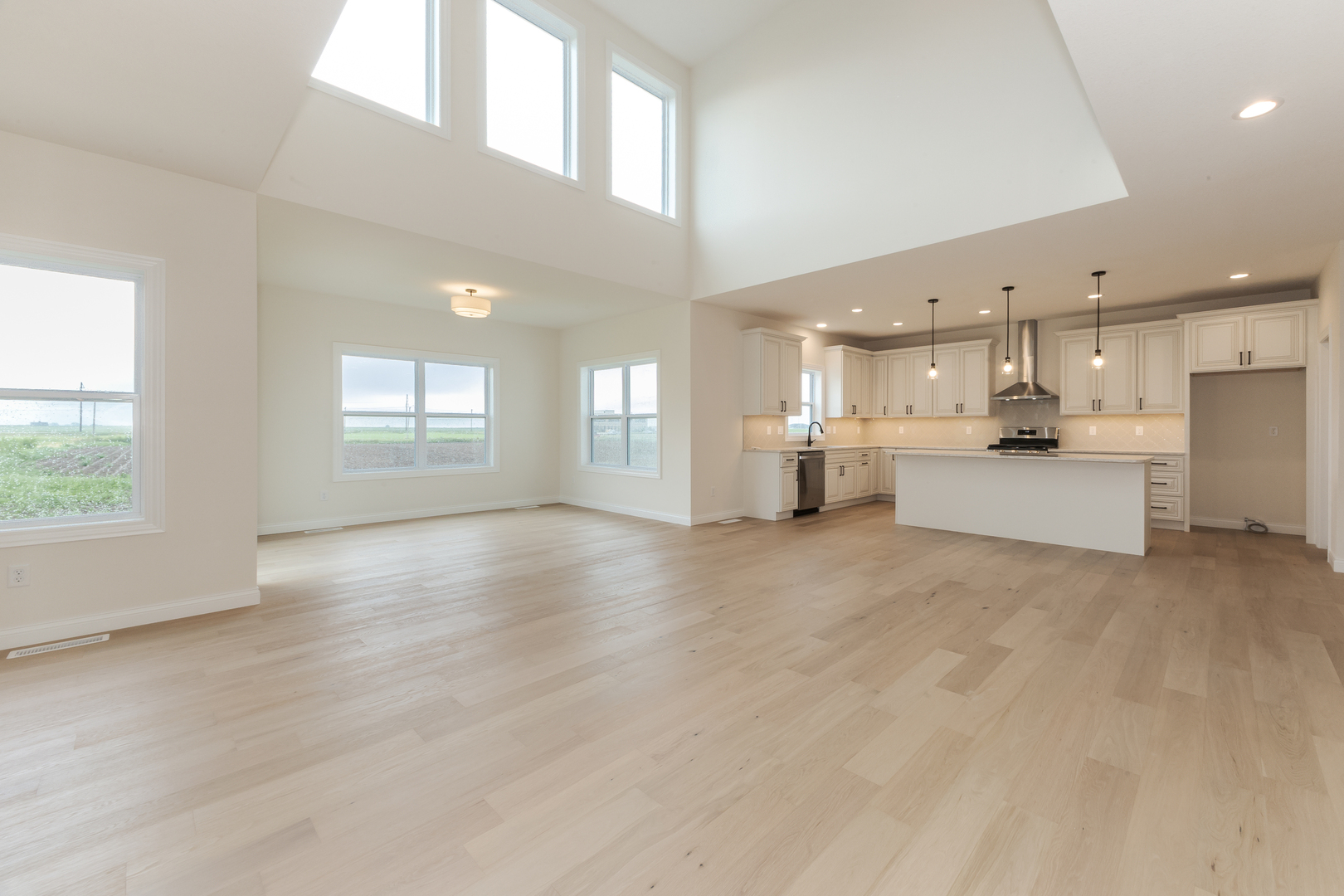 1313 Woodbine Road Bloomington, IL 61704 - Photo 35 of 67 a view of a kitchen with windows and chandelier