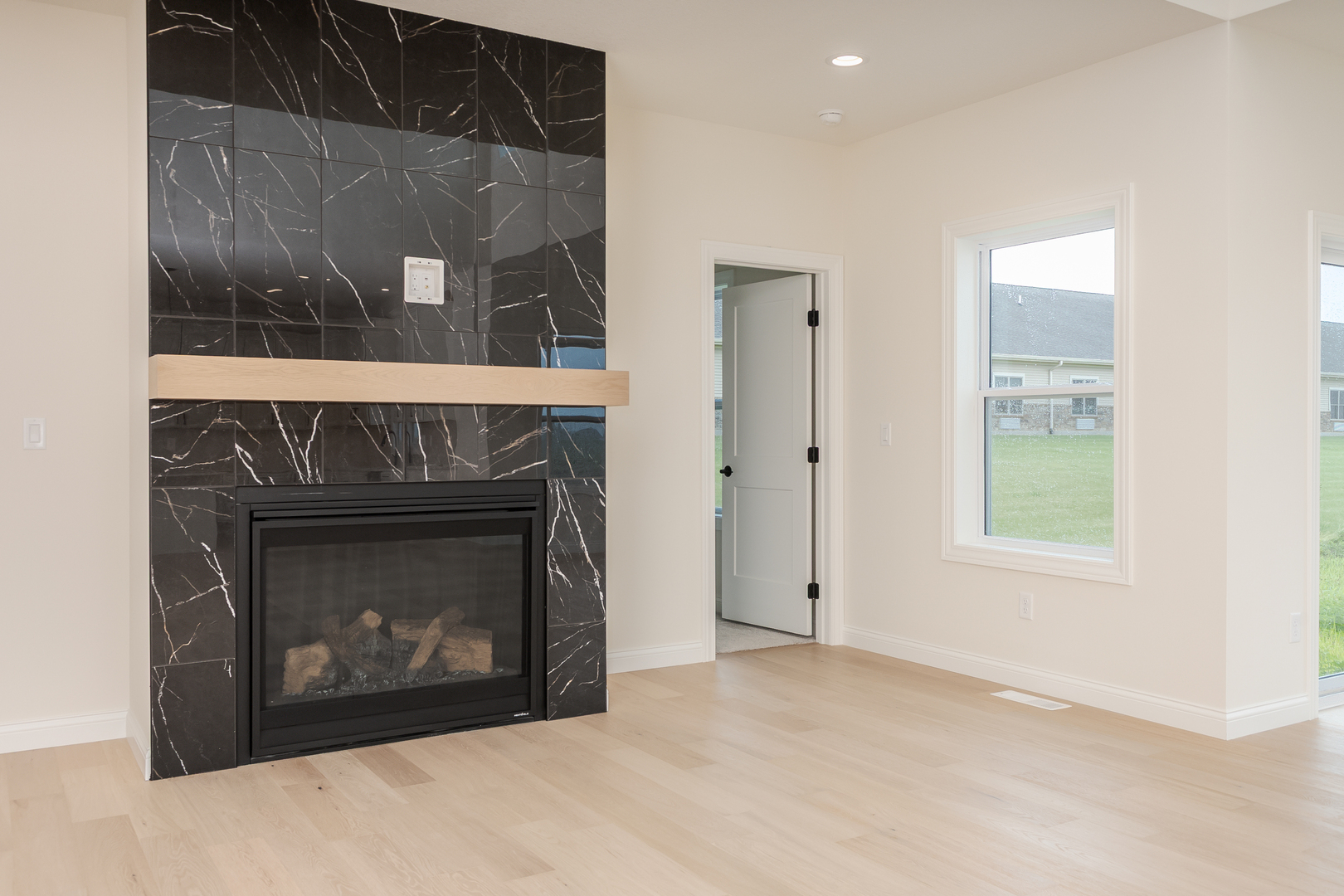 1313 Woodbine Road Bloomington, IL 61704 - Photo 37 of 67 a view of an empty room with a fireplace