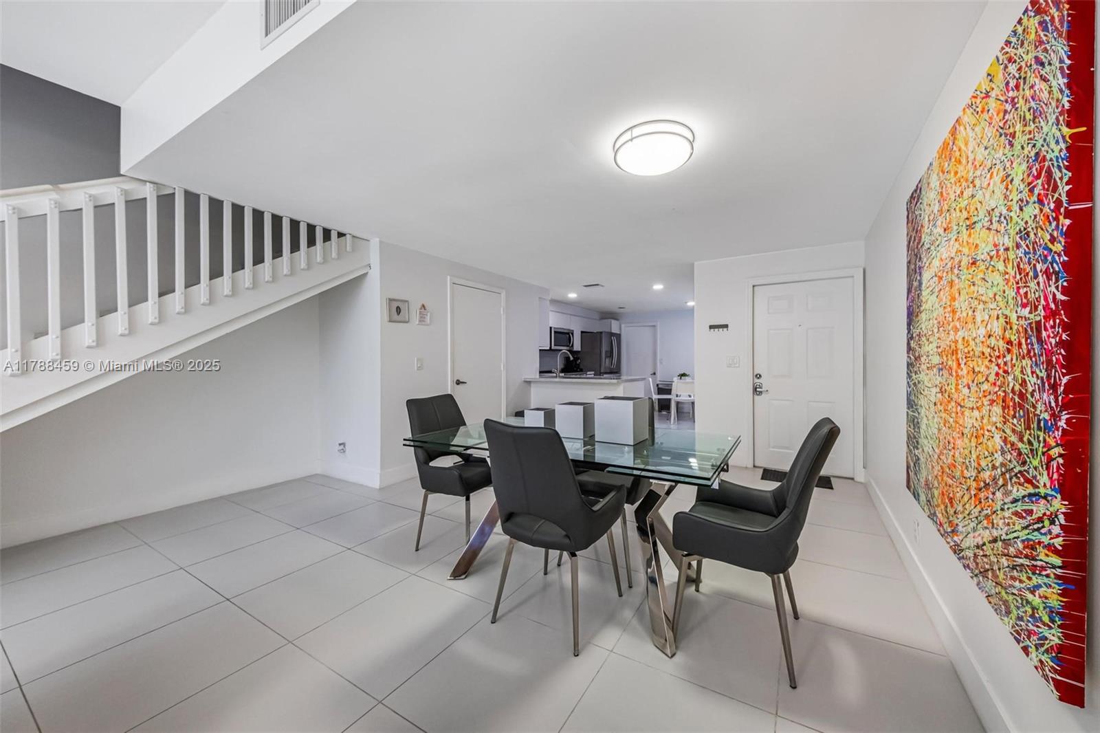 1524 Coronado Road, Unit 535 Fort Lauderdale, FL 33327 - Photo 12 of 54 a view of a dining room with furniture and wooden floor