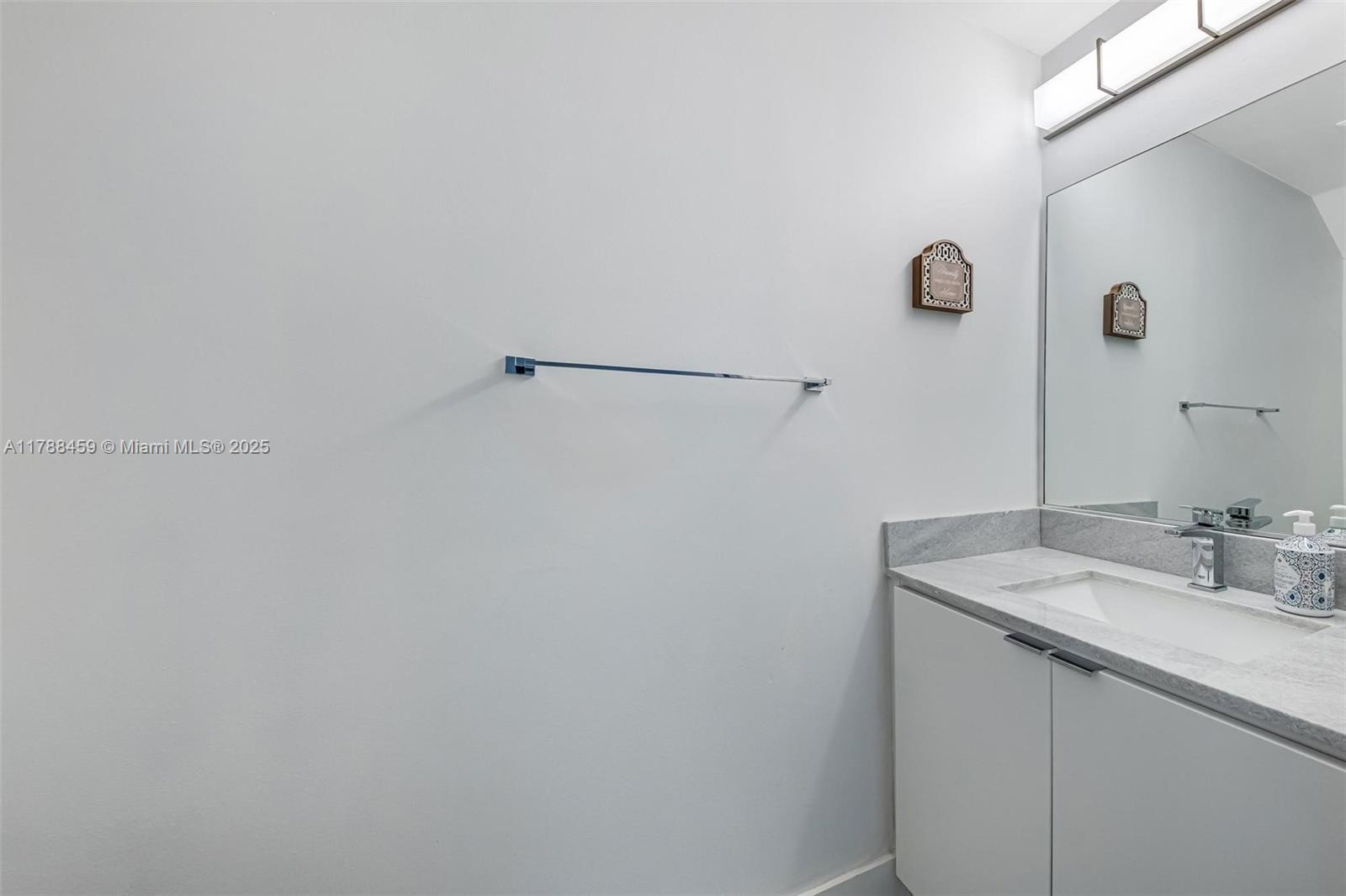 1524 Coronado Road, Unit 535 Fort Lauderdale, FL 33327 - Photo 18 of 54 a bathroom with a sink and vanity