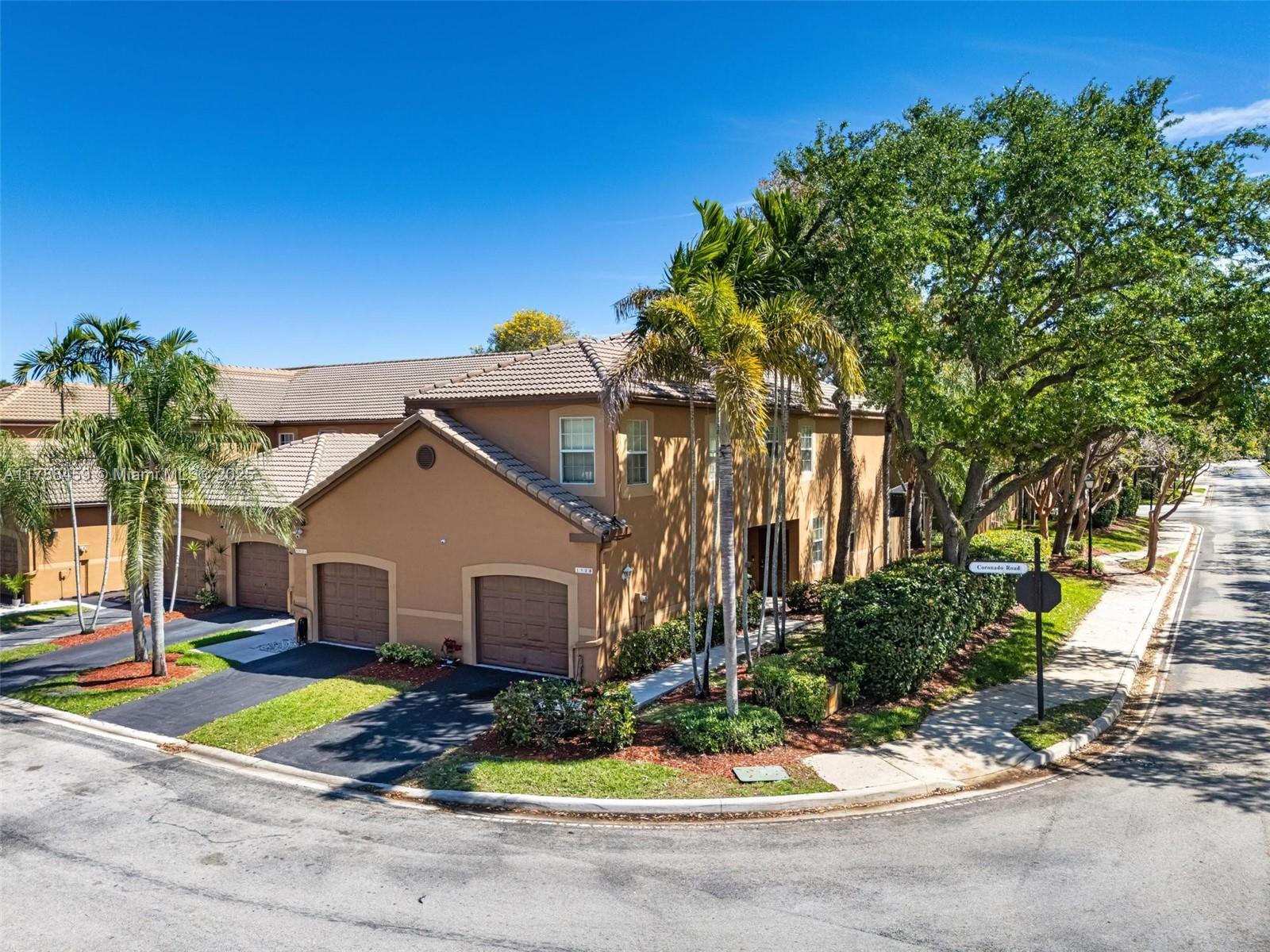 1524 Coronado Road, Unit 535 Fort Lauderdale, FL 33327 - Photo 2 of 54 a view of house with yard and tree in front of it