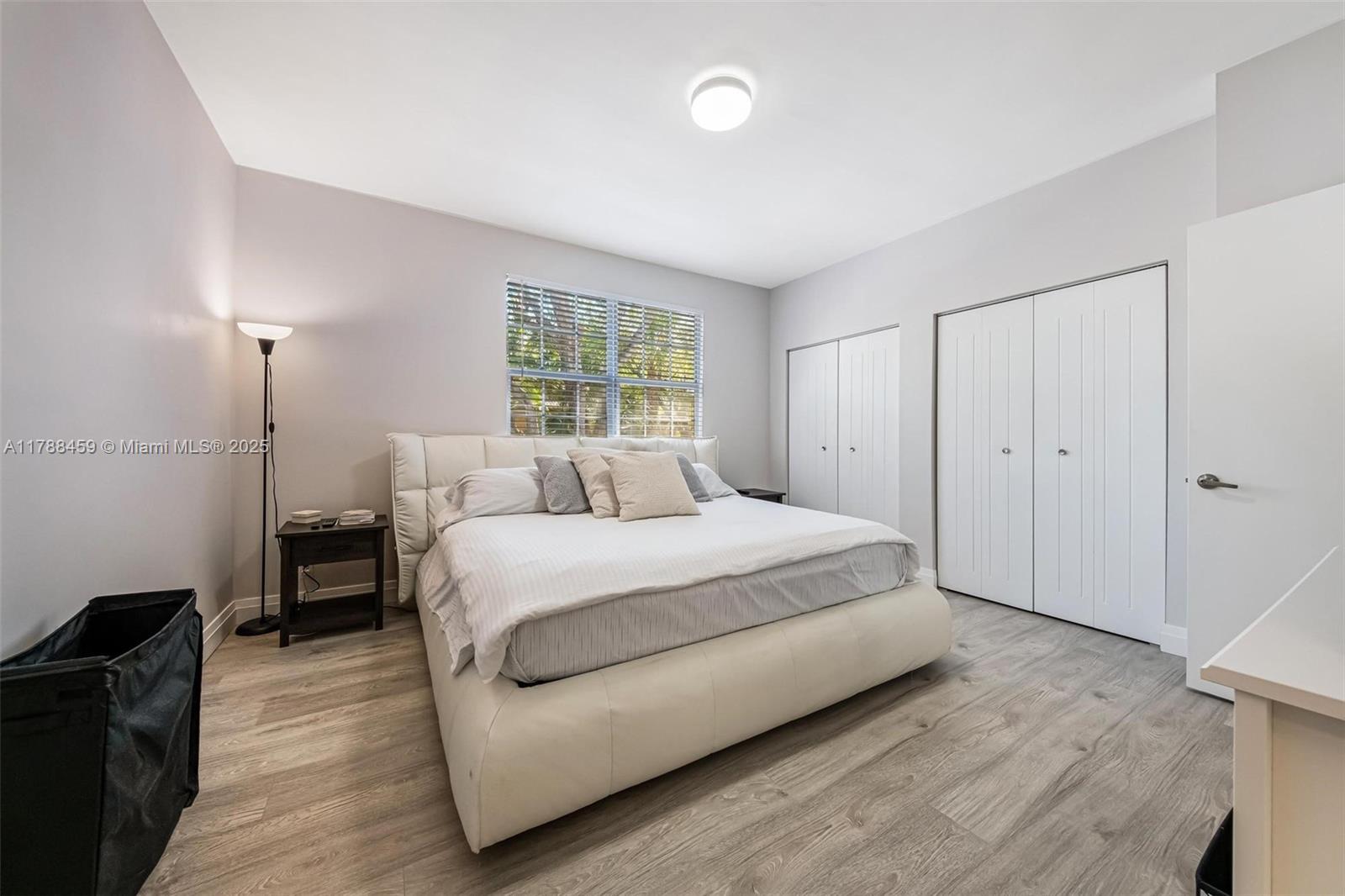 1524 Coronado Road, Unit 535 Fort Lauderdale, FL 33327 - Photo 24 of 54 a spacious bedroom with a bed and a window