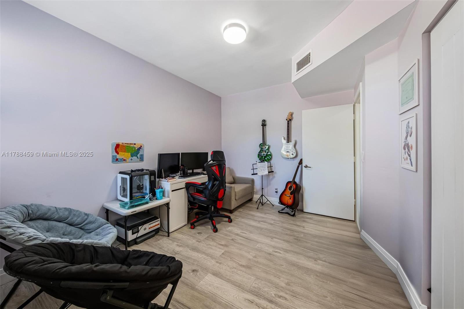 1524 Coronado Road, Unit 535 Fort Lauderdale, FL 33327 - Photo 29 of 54 a living room with furniture and a wooden floor