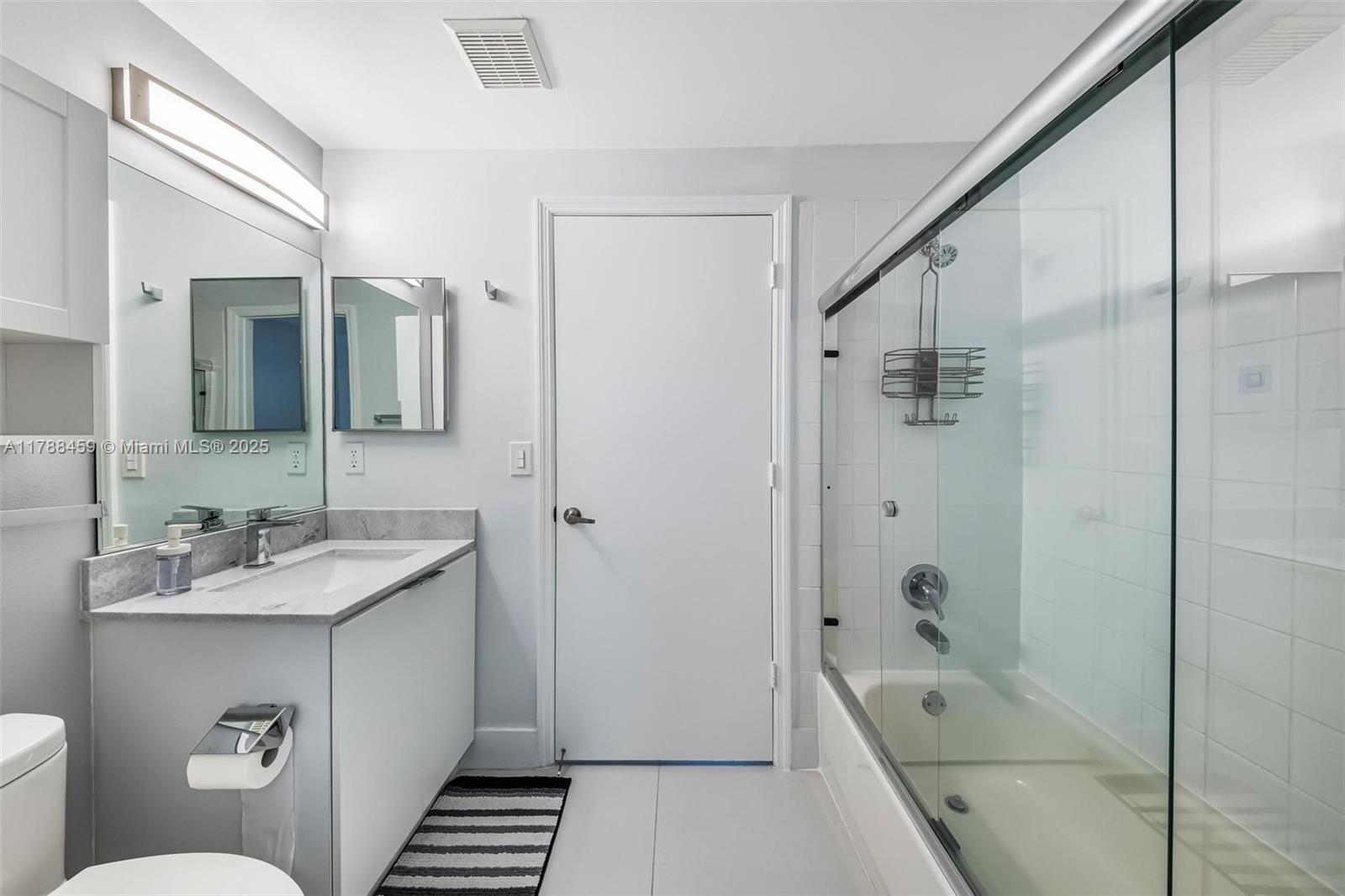 1524 Coronado Road, Unit 535 Fort Lauderdale, FL 33327 - Photo 31 of 54 a bathroom with a sink a toilet and shower