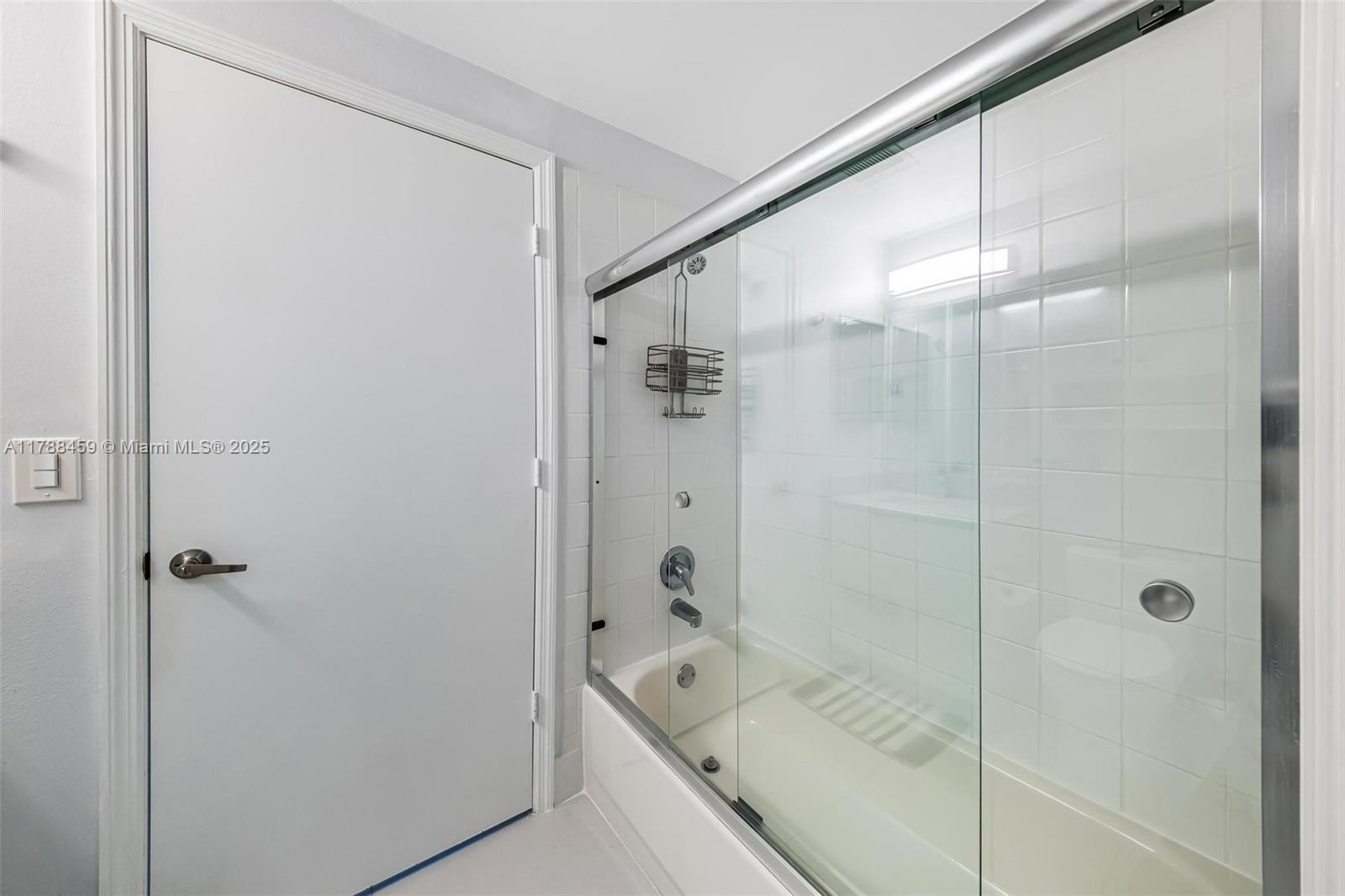1524 Coronado Road, Unit 535 Fort Lauderdale, FL 33327 - Photo 32 of 54 a bathroom with a bathtub and a shower