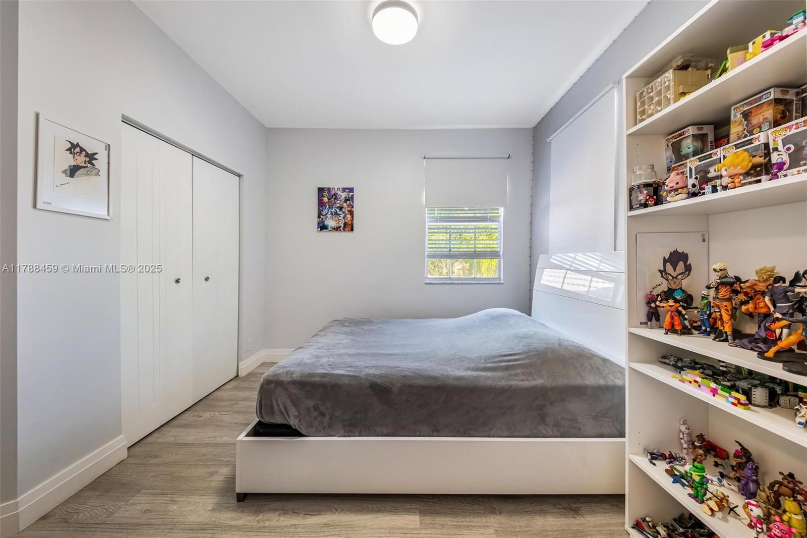 1524 Coronado Road, Unit 535 Fort Lauderdale, FL 33327 - Photo 35 of 54 a bedroom with a bed and a window