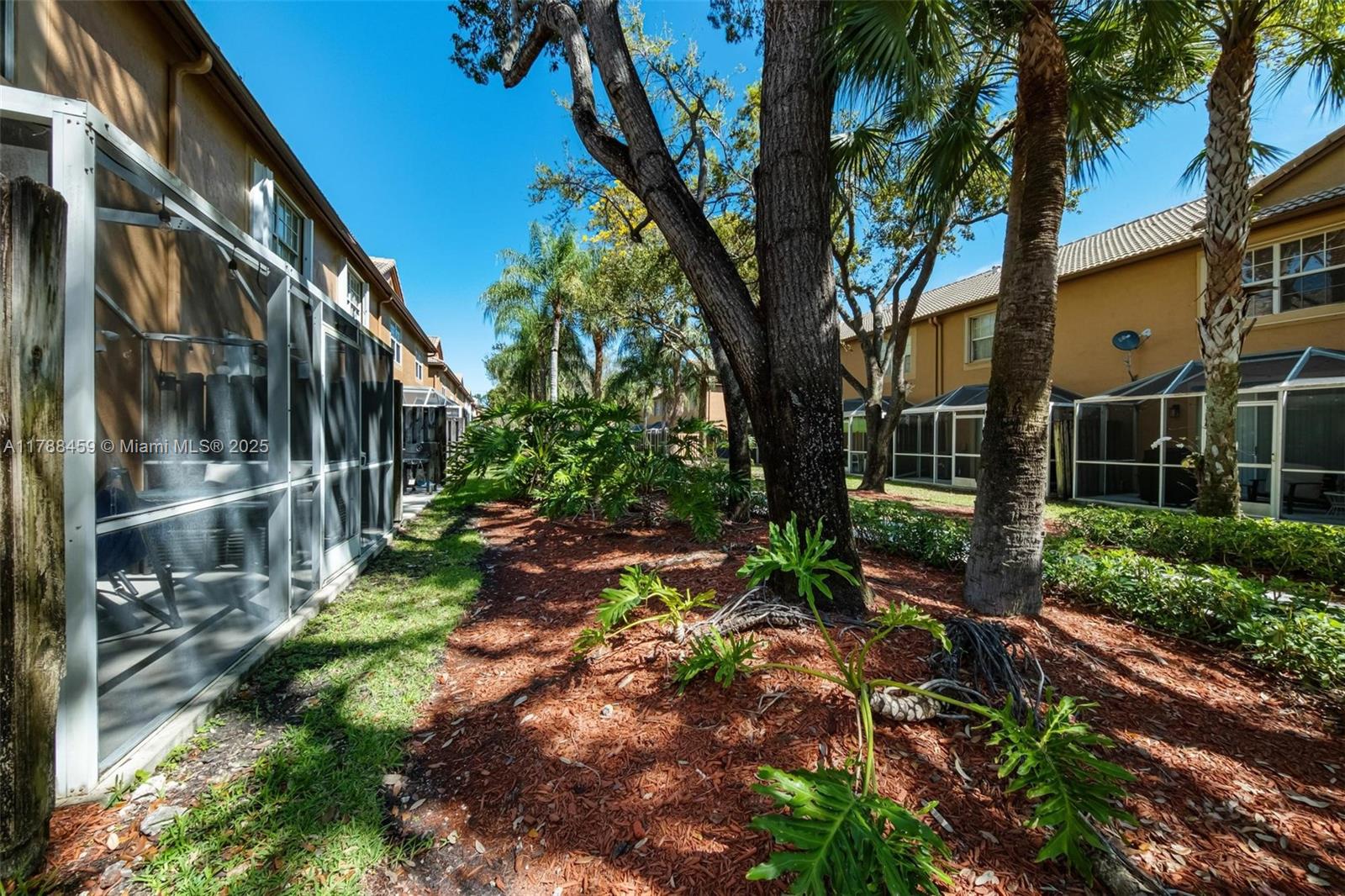 1524 Coronado Road, Unit 535 Fort Lauderdale, FL 33327 - Photo 44 of 54 a backyard of a house with lots of green space