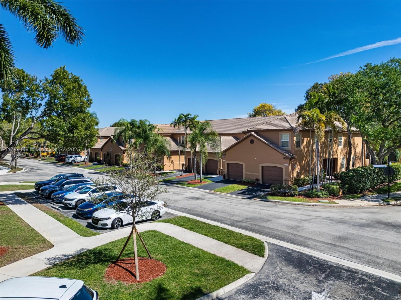 1524 Coronado Road, Unit 535 Fort Lauderdale, FL 33327 - Photo 47 of 54 a front view of a house with garden