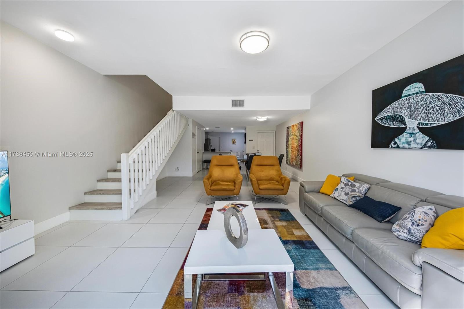 1524 Coronado Road, Unit 535 Fort Lauderdale, FL 33327 - Photo 8 of 54 a living room with furniture and wooden floor