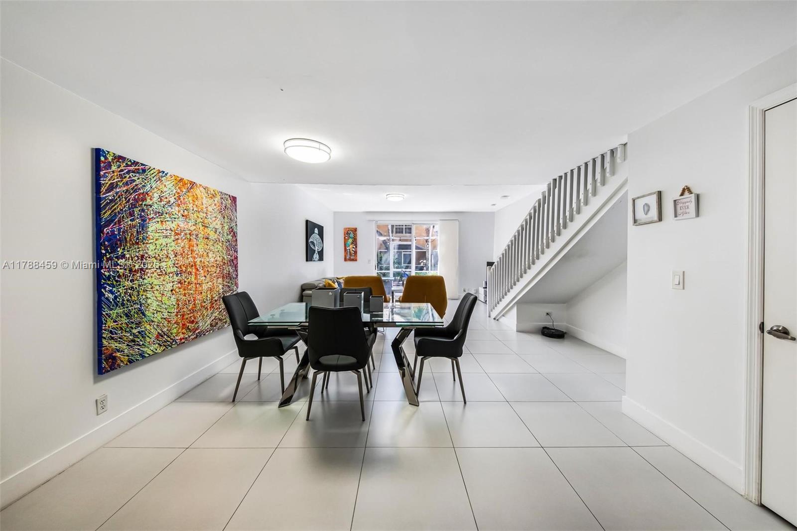 1524 Coronado Road, Unit 535 Fort Lauderdale, FL 33327 - Photo 10 of 54 a dining room with furniture and entryway