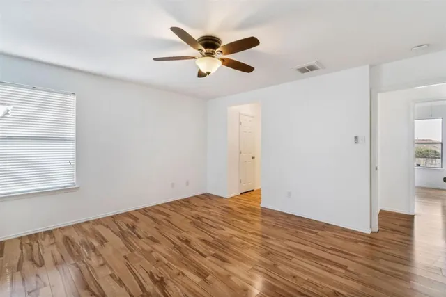 a bathroom with a bathtub a sink and a large mirror