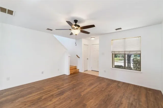 a kitchen with stainless steel appliances granite countertop a stove top oven a sink dishwasher and a microwave oven with cabinets