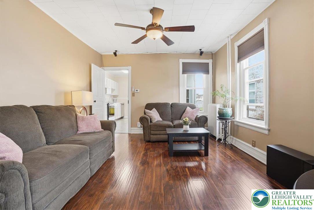 525 Ridge Street Emmaus, PA 18049 - Photo 10 of 68 This living room features gleaming hardwood floors and ample natural light, creating a bright and inviting atmosphere.