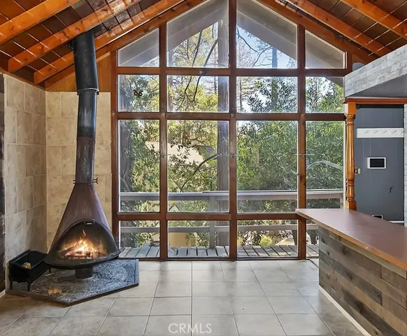 a room with large window and a couch