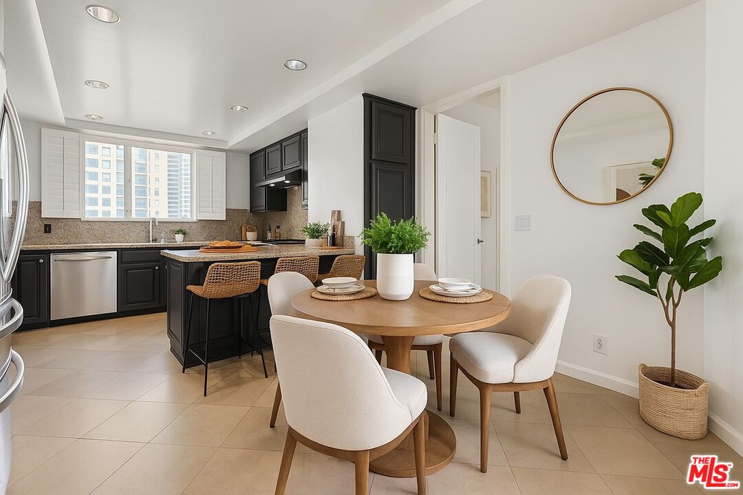 10550 Wilshire Boulevard, Unit 804 Los Angeles, CA 90024 - Photo 2 of 22 a dining room with furniture a potted plant and a sink