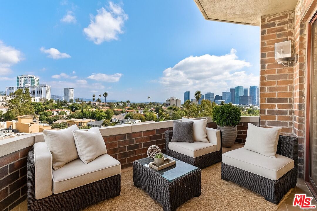 10550 Wilshire Boulevard, Unit 804 Los Angeles, CA 90024 - Photo 3 of 22 a view of a terrace with couches and a potted plant