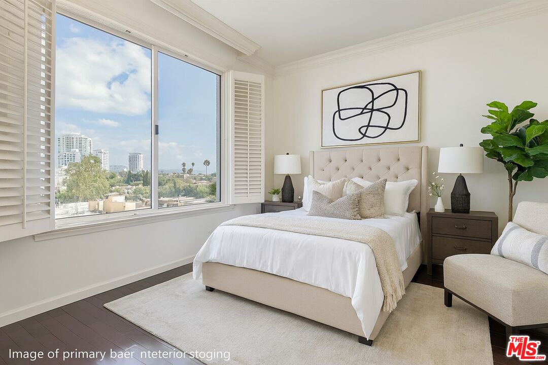 10550 Wilshire Boulevard, Unit 804 Los Angeles, CA 90024 - Photo 4 of 22 a bed sitting in a bedroom next to a window
