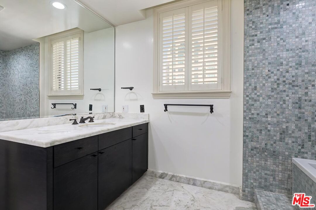 10550 Wilshire Boulevard, Unit 804 Los Angeles, CA 90024 - Photo 7 of 22 a bathroom with a sink and a mirror