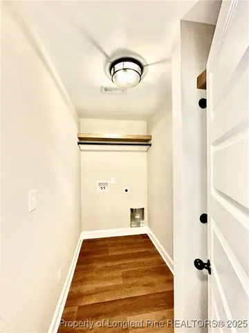 an empty room with a ceiling fan and window