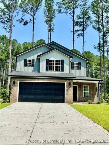 a view of a hallway view with wooden floor and staircase